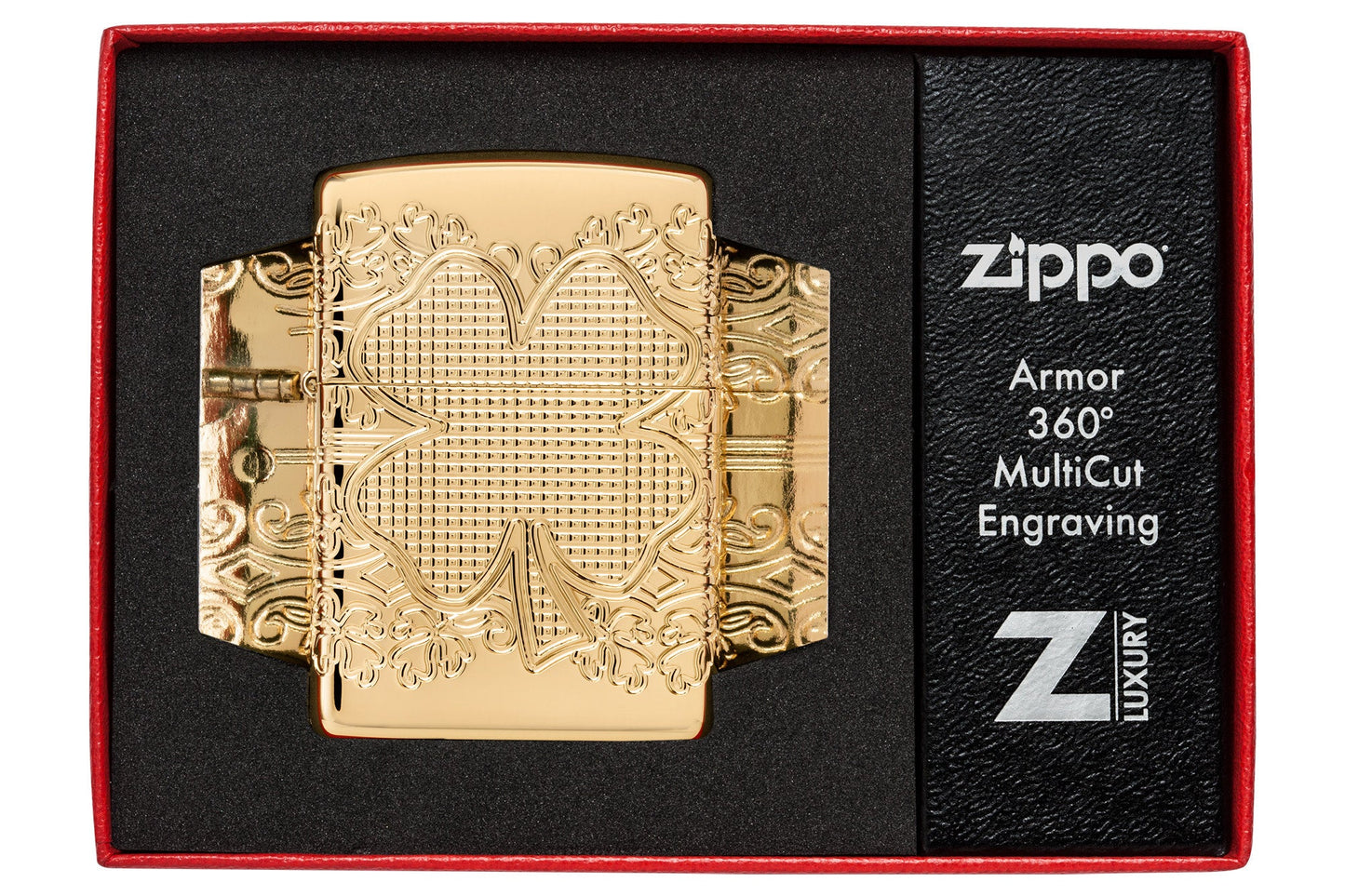 Zippo Lucky Clover Design Armor?? High Polish Gold Plate Windproof Lighter in its packaging.
