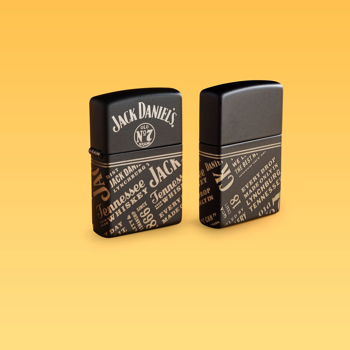 Lifestyle image of two Zippo Jack Daniel's?? Every Drop Design Regular Media Chrome Black Matte Windproof Lighters standing with a pale yellow background.