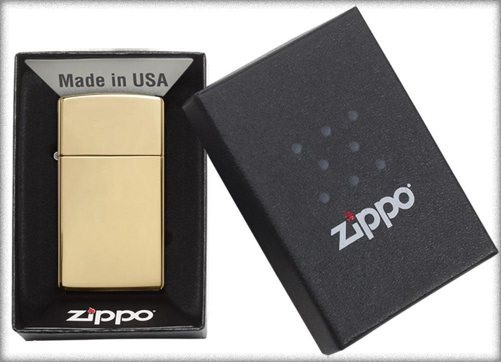 Slim?? High Polish Brass Finish Windproof Lighter in its packaging.