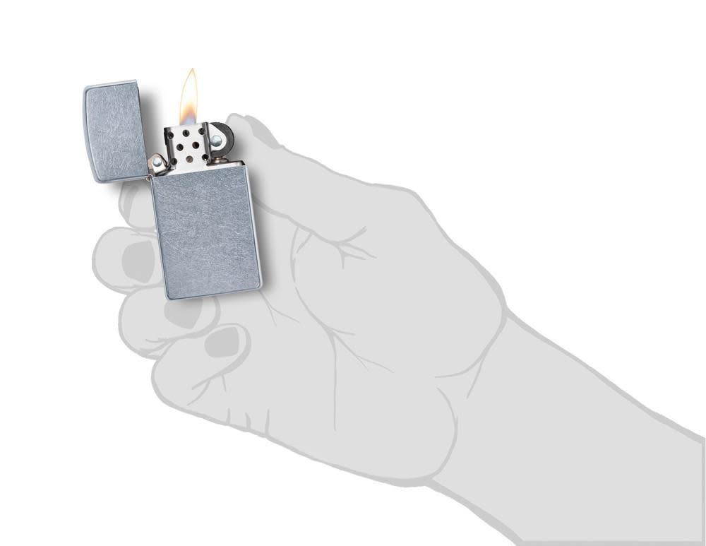 Slim?? Street ChromeÆ?âº Windproof Lighter lit in hand.
