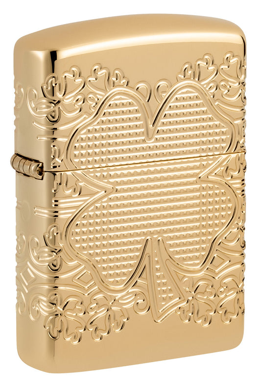 Front shot of Zippo Lucky Clover Design Armor?? High Polish Gold Plate Windproof Lighter standing at a 3/4 angle.