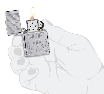 Zippo Waxy Leaf Design Armor?? High Polish Chrome Windproof Lighter lit in hand.