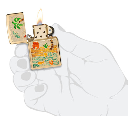 Zippo Beach Day Design High Polish Brass Windproof Lighter lit in hand.