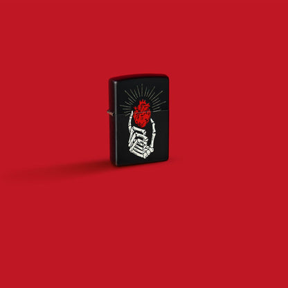Lifestyle image of Zippo Undying Love Design Black Matte Windproof Lighter in a red scene.