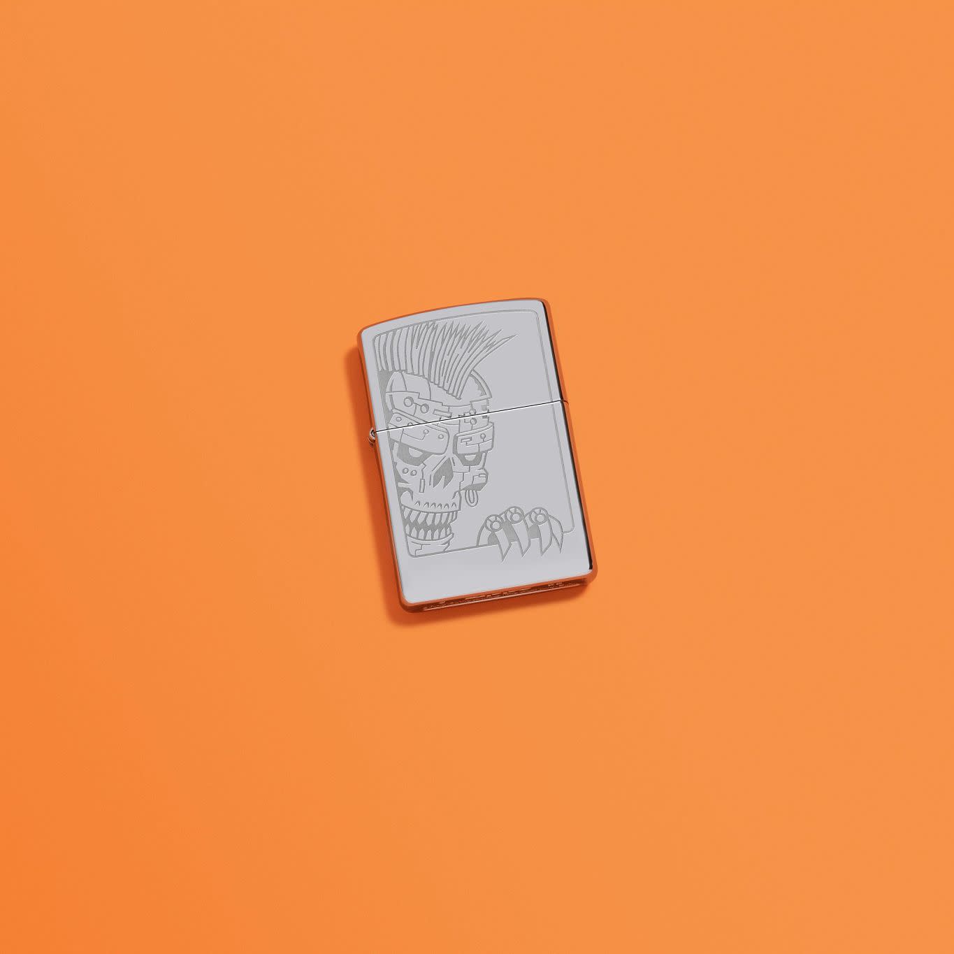 Lifestyle image of Zippo Mohawk Skull Design High Polish Chrome Windproof Lighter in an orange scene.