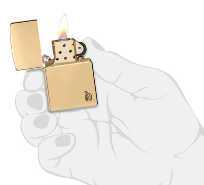 Zippo Armor?? Series Flame High Polish Brass Windproof Lighter lit in hand.