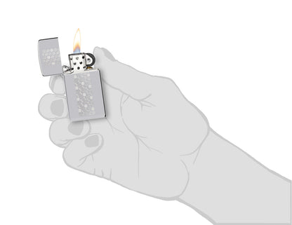 Zippo Slim?? Honeycomb Design High Polish Chrome Windproof Lighter lit in hand.