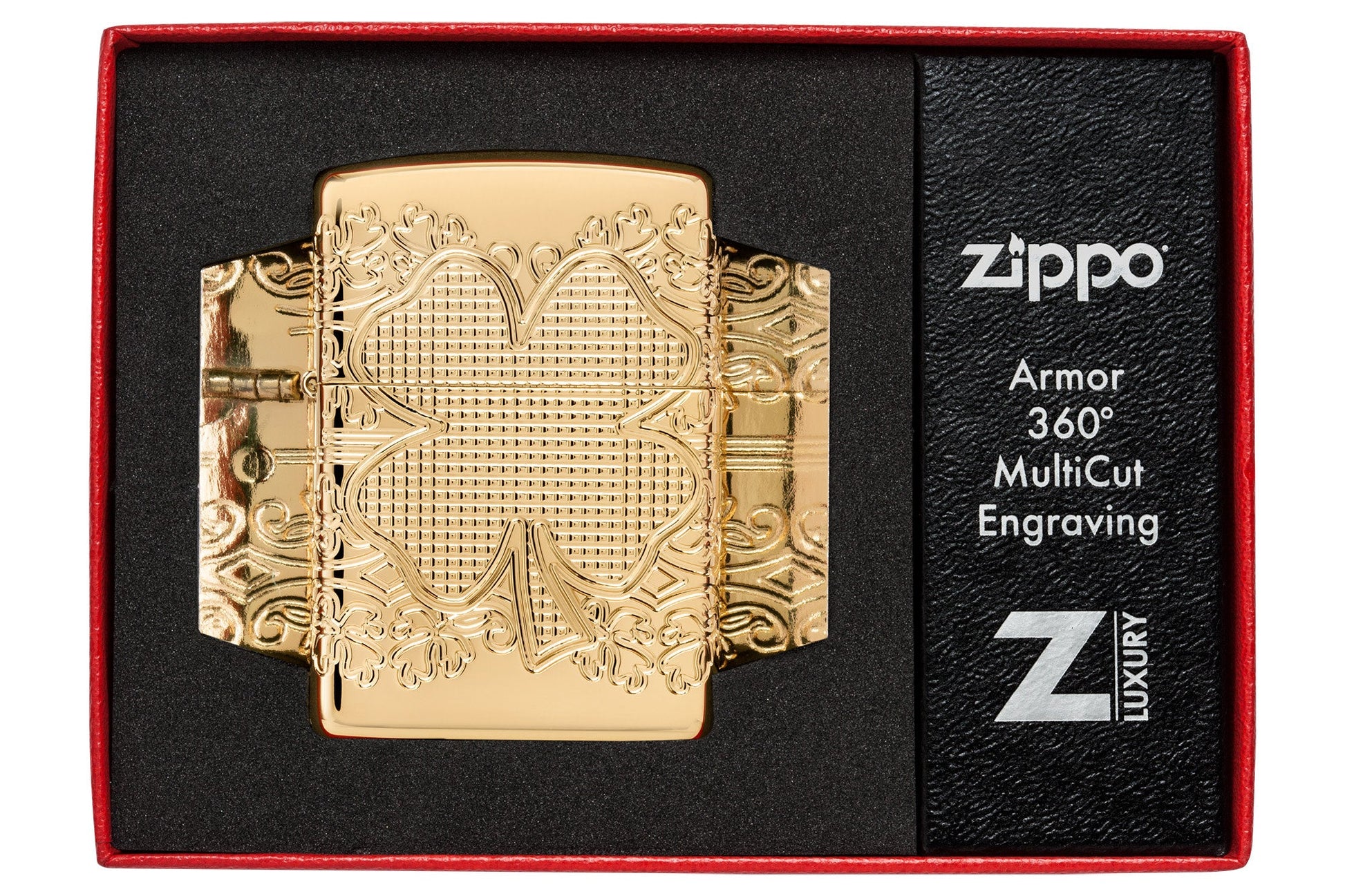 Zippo Lucky Clover Design Armor?? High Polish Gold Plate Windproof Lighter in its packaging.