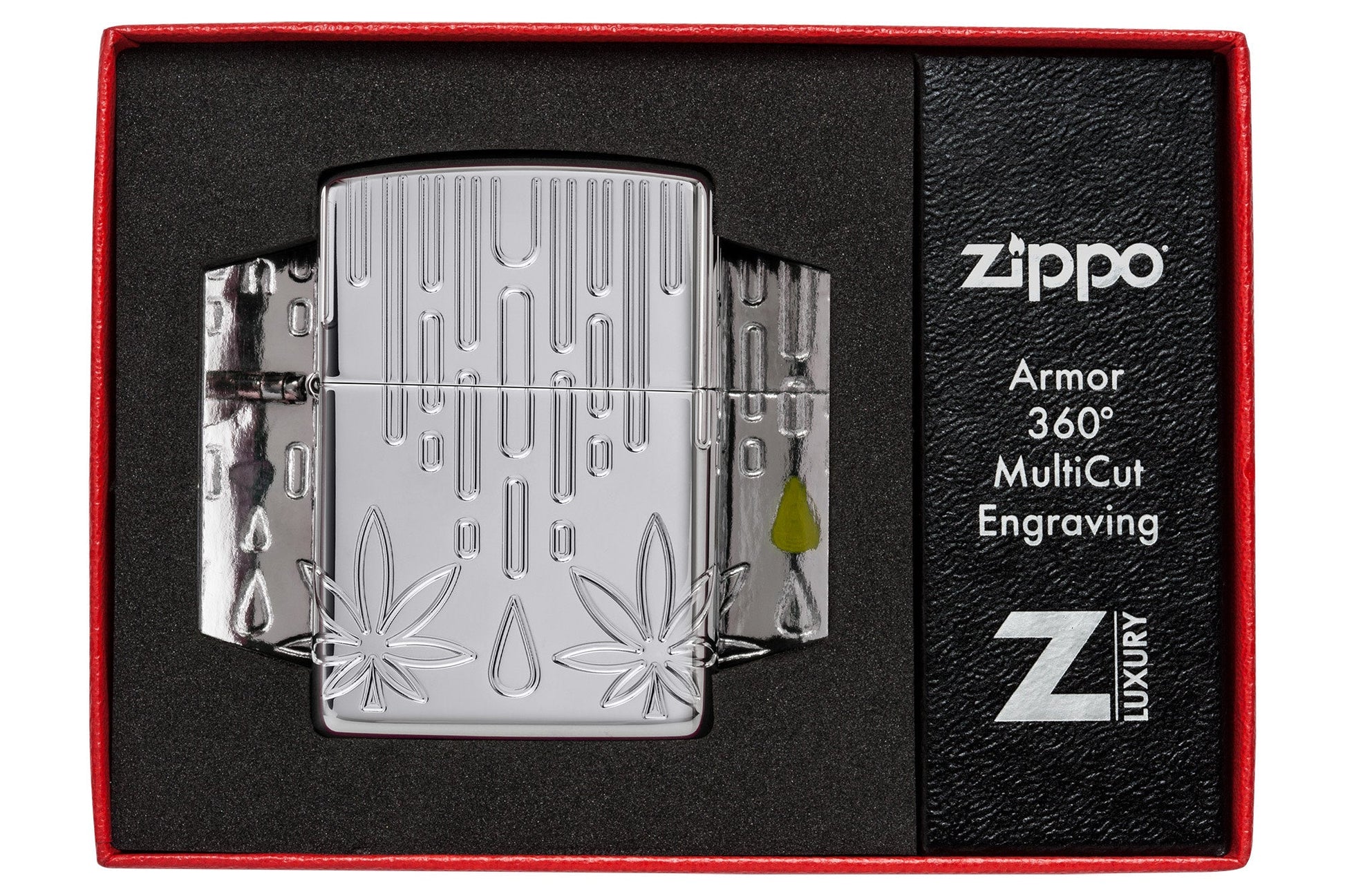 Zippo Waxy Leaf Design Armor?? High Polish Chrome Windproof Lighter in its packaging.